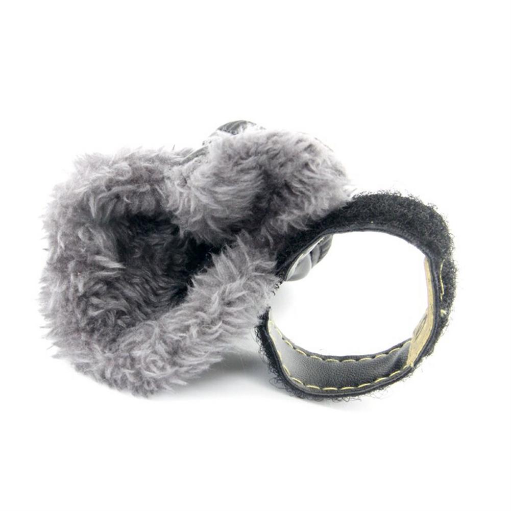 Gray plush toy with a circular ring on a white background