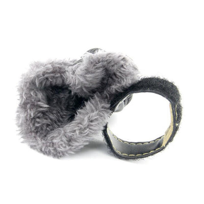 Gray plush toy with a circular ring on a white background