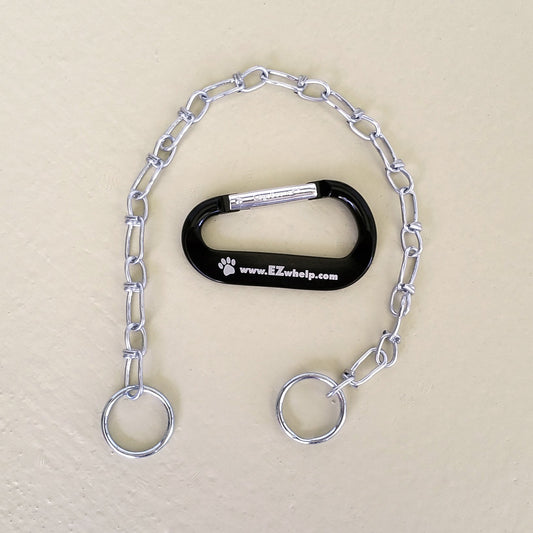 Dog training tool with chain and carabiner on a beige background
