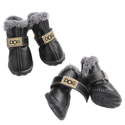 Pair of black dog boots with fur lining and 'DOG' label on a white background