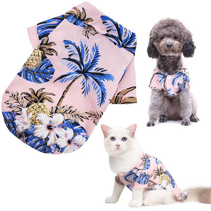 Hawaiian-style pet shirts for dogs and cats with floral and pineapple design on a white background.