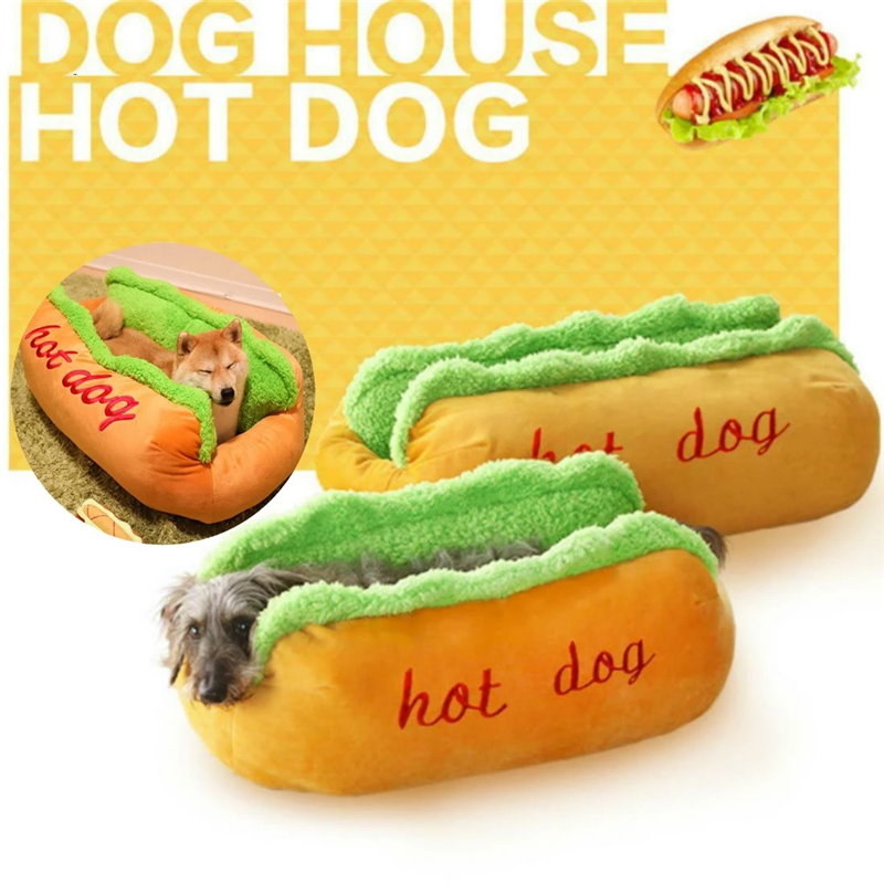 Dog house shaped like a hot dog with a small dog inside, on a white background.