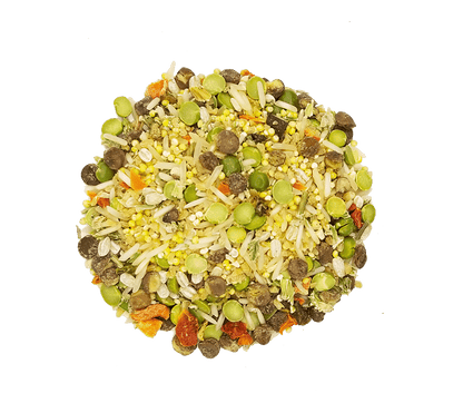 Round mixture of rice, beans, and vegetables on a green background