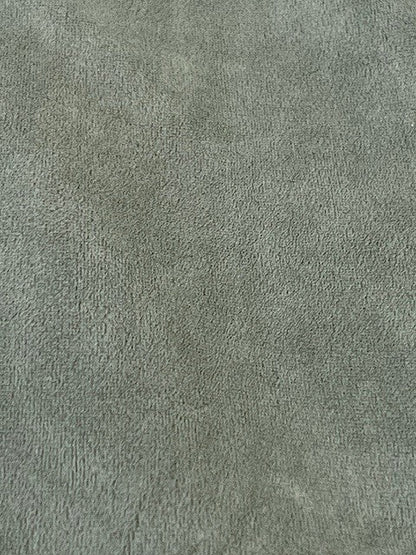 Solid green color swatch with a textured pattern