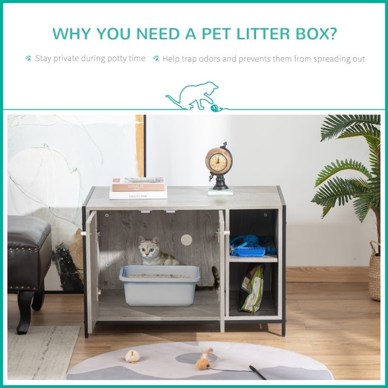 Pet litter box inside a cabinet with a cat inside, on a wooden floor with a plant and clock in the background.