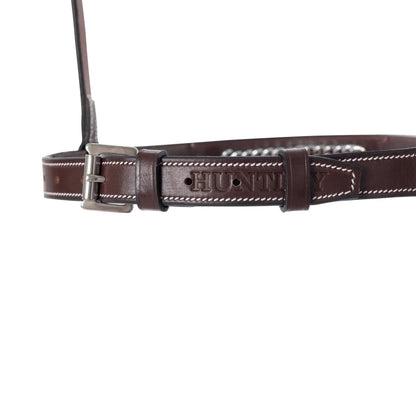 Brown leather belt with silver buckle on a white background