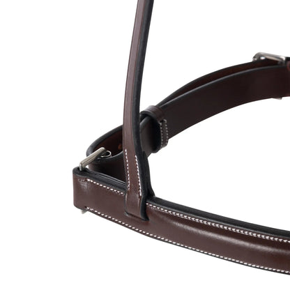 Close-up of a brown leather bridle on a white background