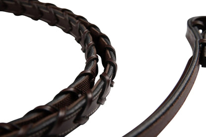 Close-up of a brown leather bridle on a white background