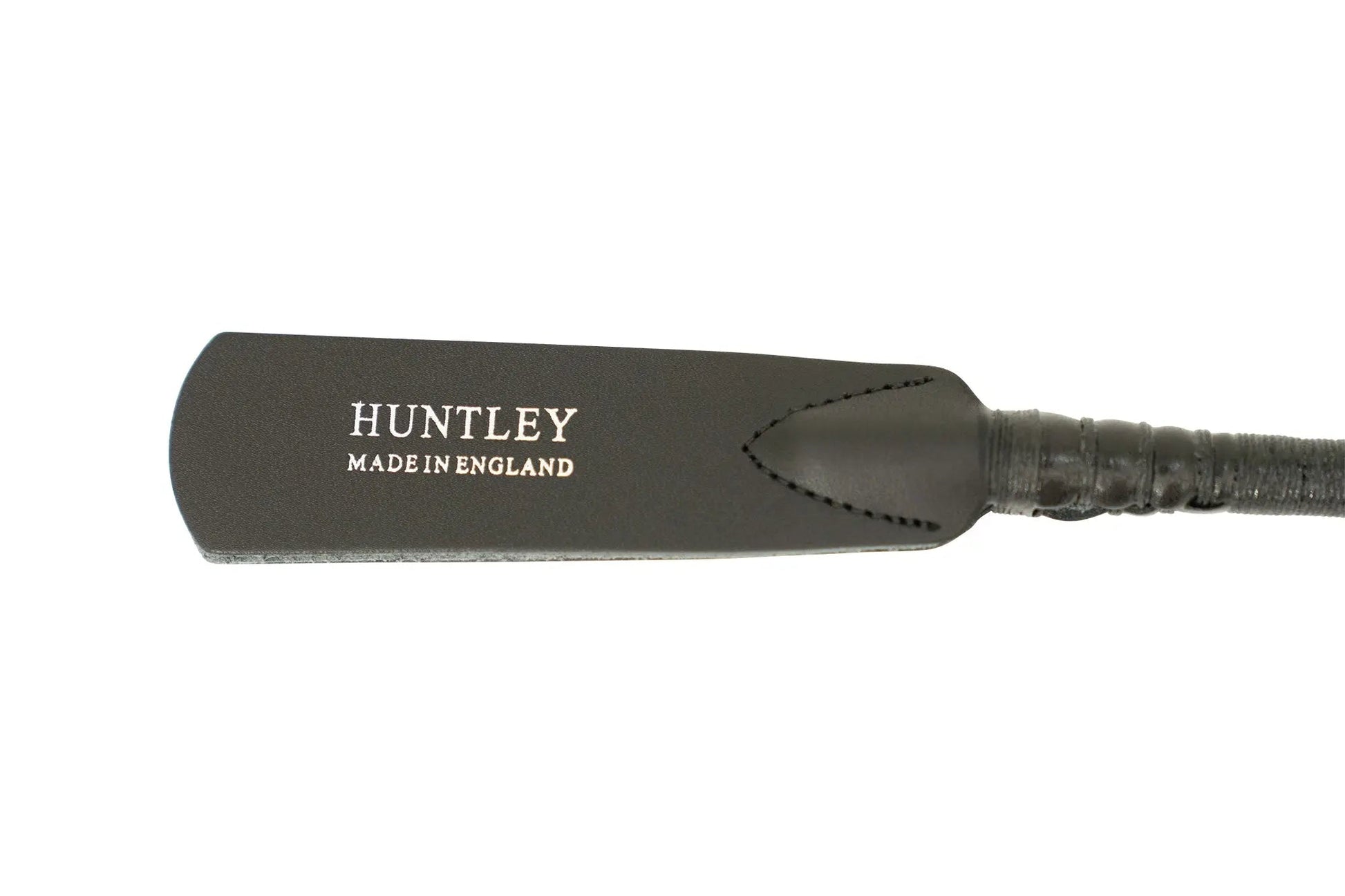 Black leather paddle with 'Huntley Made in England' branding on a white background