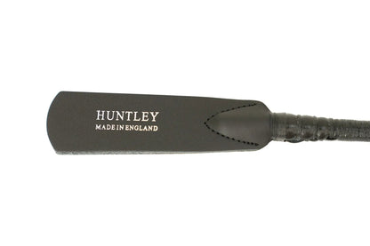 Black leather paddle with 'Huntley Made in England' branding on a white background