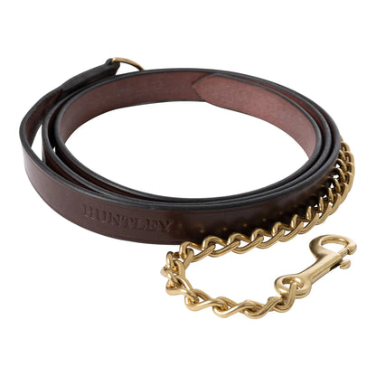 Brown leather dog leash with gold chain and 'Huntley' branding on a white background