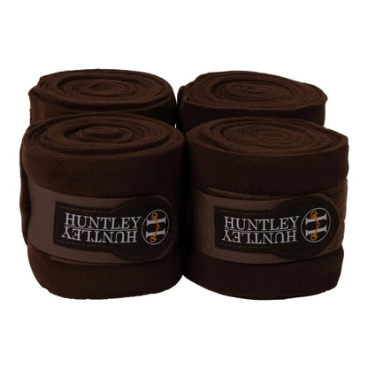 Four rolls of Huntley brown bandage on a white background