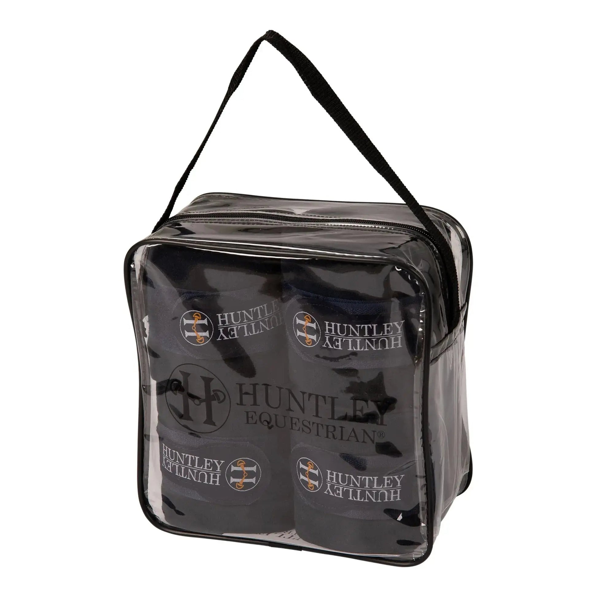 Clear travel bag with black handles containing Huntley Equestrian products on a white background
