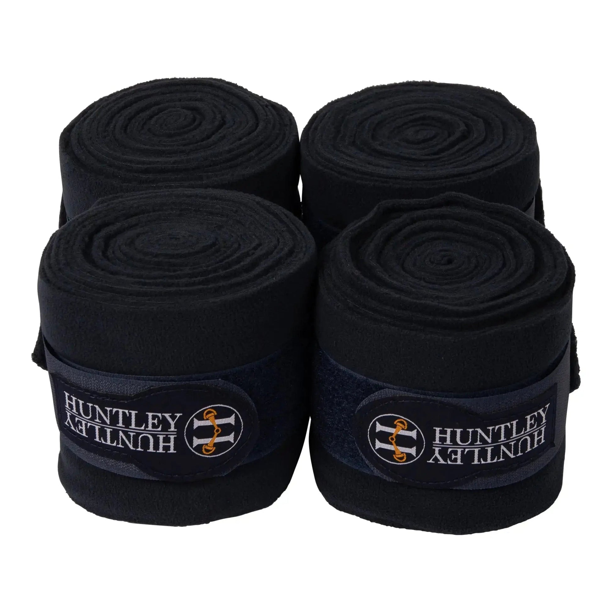 Four rolls of black Huntley bandage on a white background