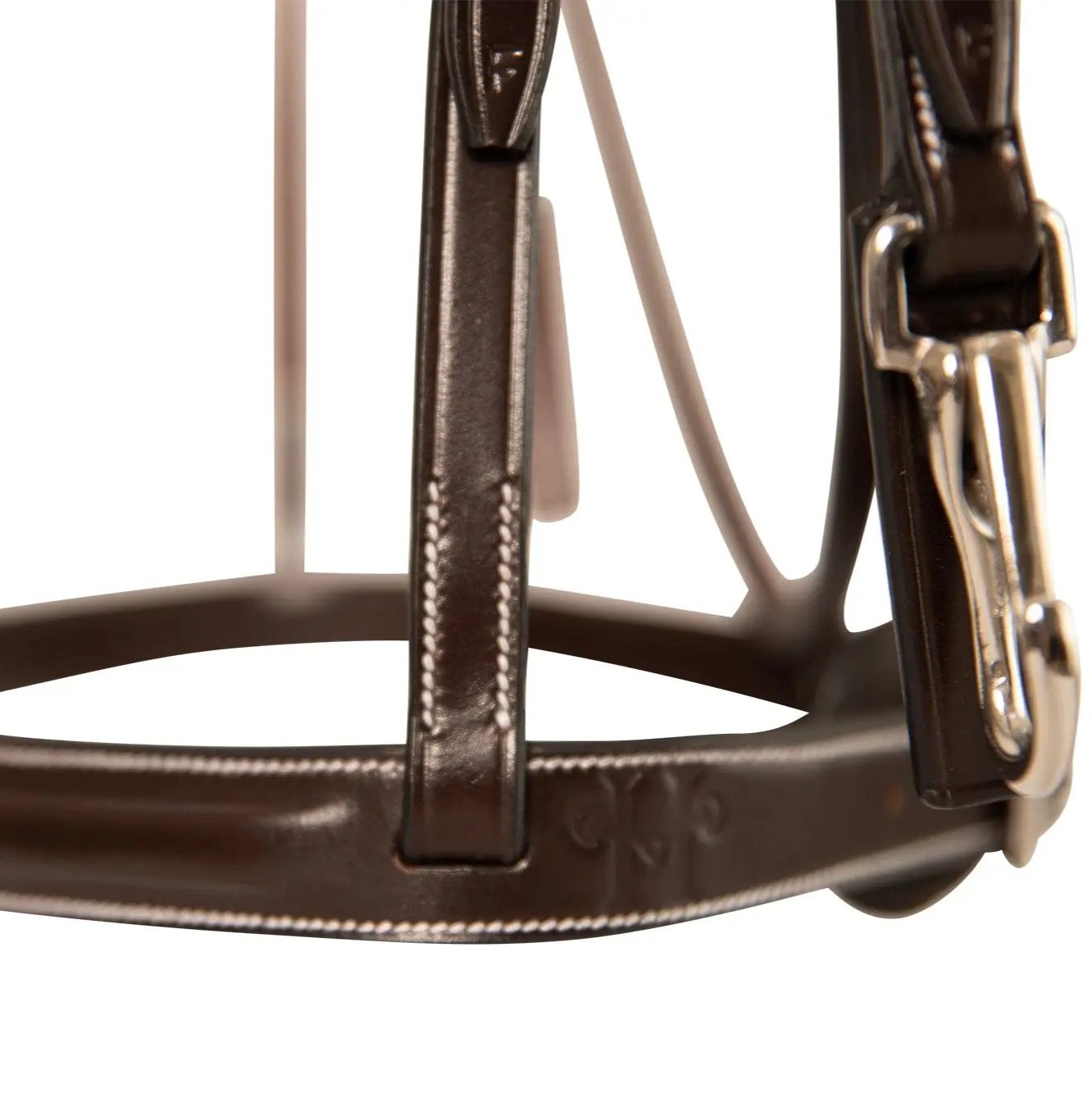 Close-up of a brown leather bridle with a metal buckle on a white background