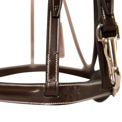 Close-up of a brown leather bridle with a metal buckle on a white background