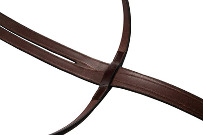 Close-up of a brown leather strap on a white background