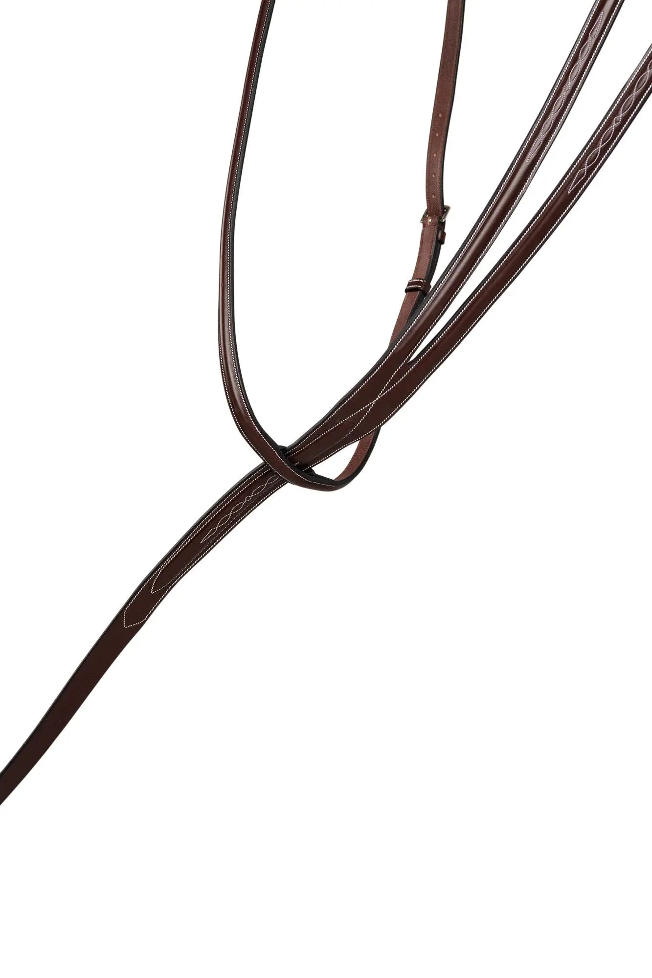 Close-up of brown leather reins on a white background