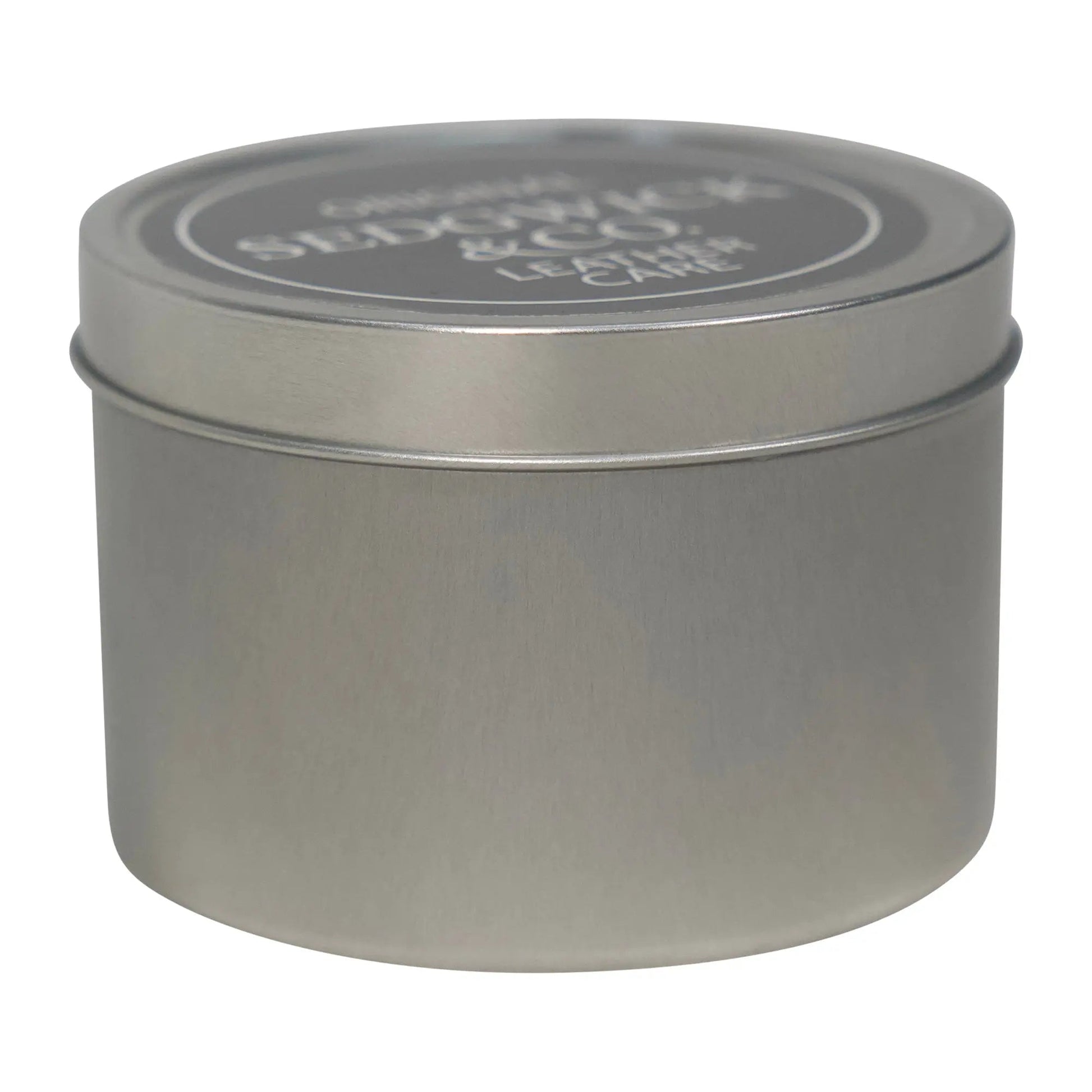 Silver cylindrical tin with lid on a white background