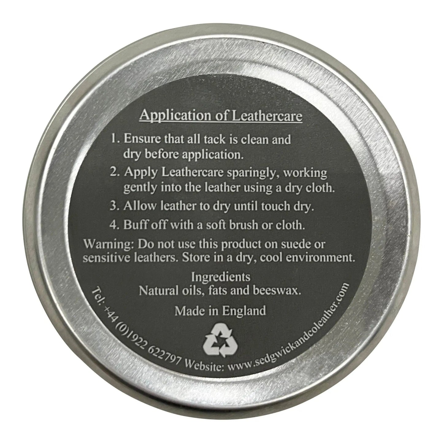 Metallic tin lid with application instructions and branding on a white background