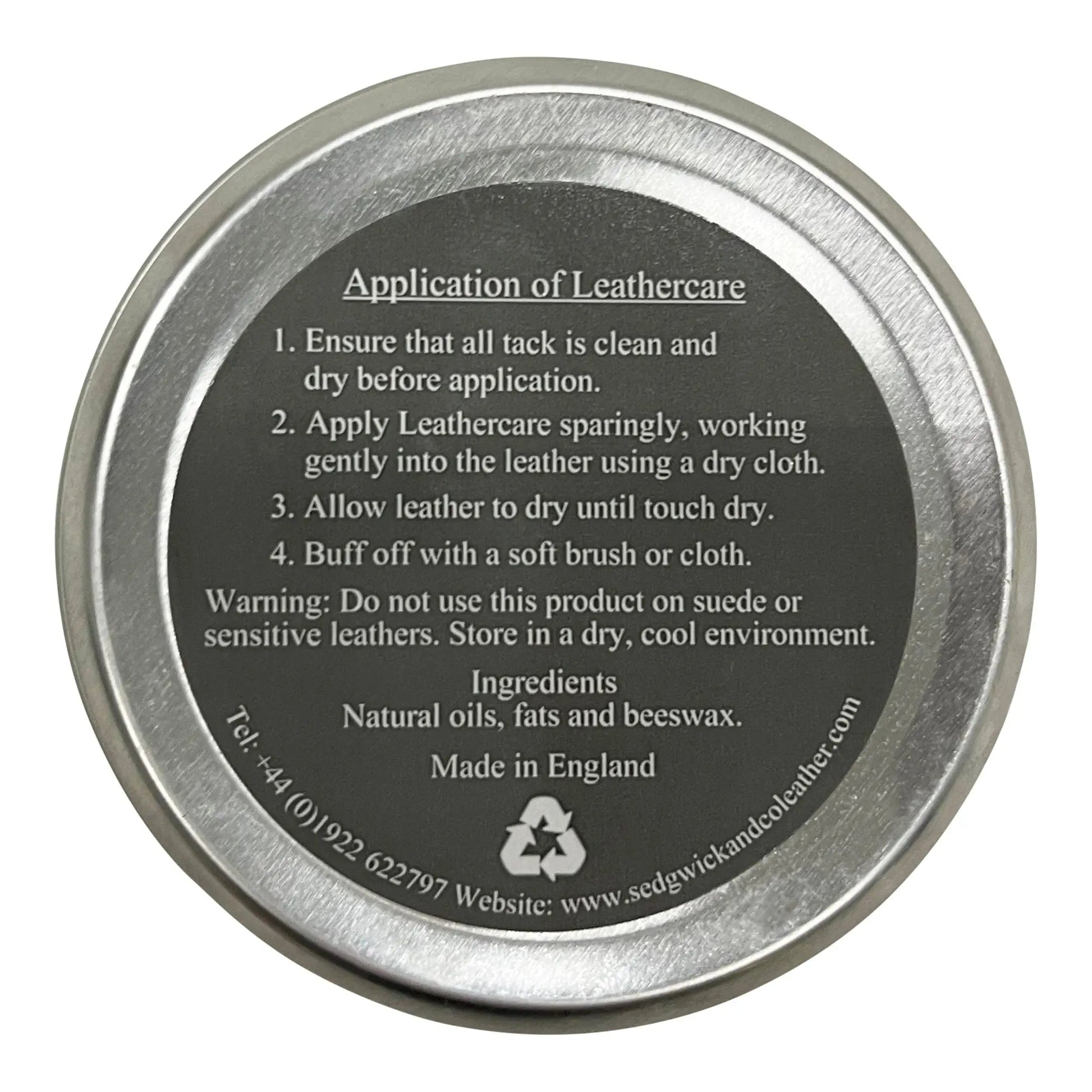 Metallic tin lid with application instructions and branding on a white background