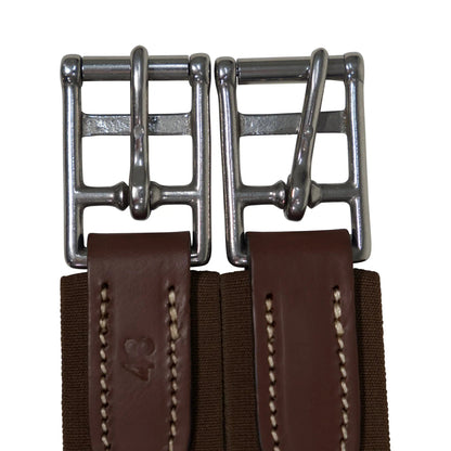 Close-up of a brown leather belt with metal buckles on a white background