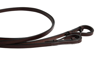 Brown leather rein on a white background