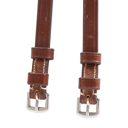 Brown leather strap with silver buckle on a white background