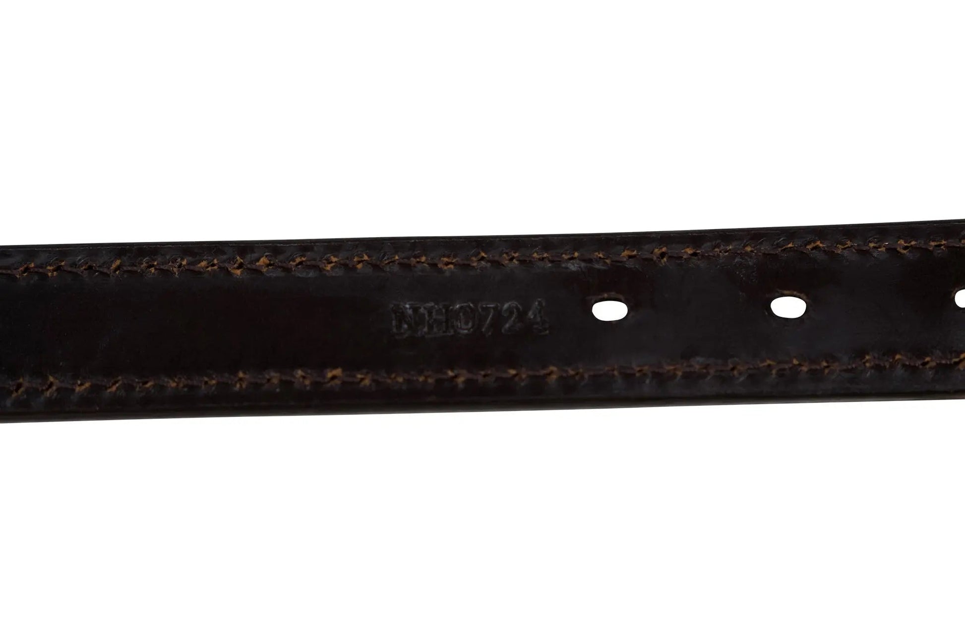Close-up of a black leather belt with visible stitching on a white background