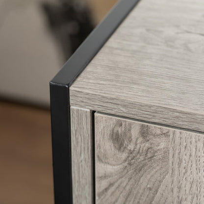 Close-up of a wooden side table with a black metal leg.