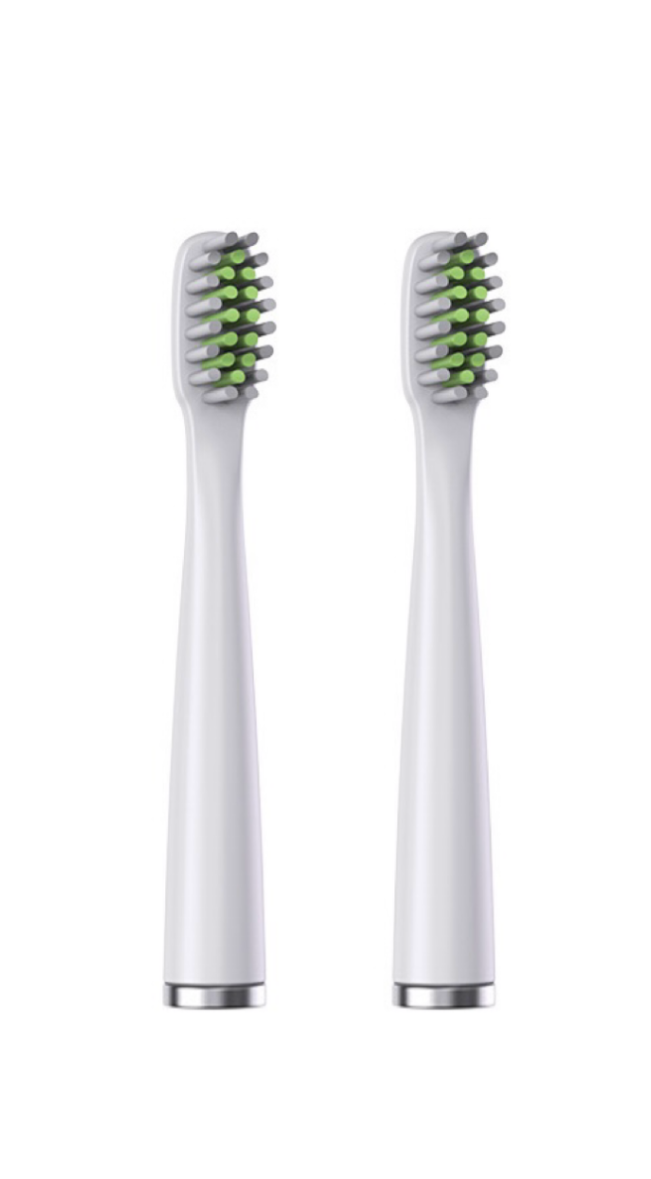 Two white electric toothbrush heads with green bristles on a white background