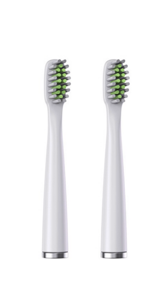 Two white electric toothbrush heads with green bristles on a white background
