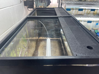 Aquaponics system with water flowing through a tank