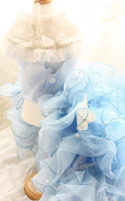 Light blue dress with ruffles on a white background