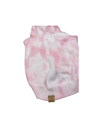 Pink and white tie-dye dog sweater on a white background