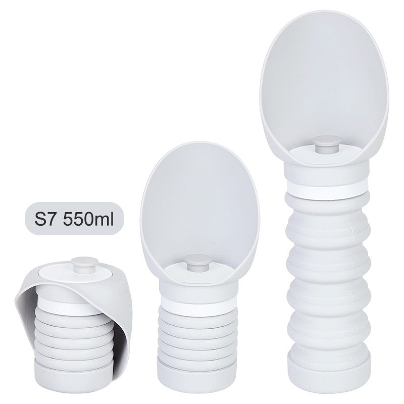 Set of three white silicone cups with varying sizes on a white background