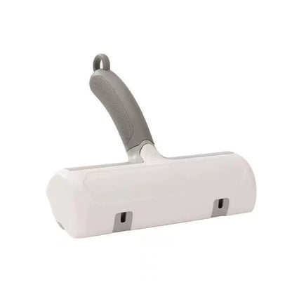 White pet grooming brush with gray handle on a white background