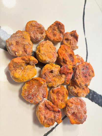 Dried apricots on a white plate with a blue napkin