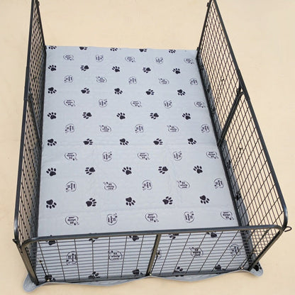 Dog crate with a patterned cover featuring paw prints on a beige background