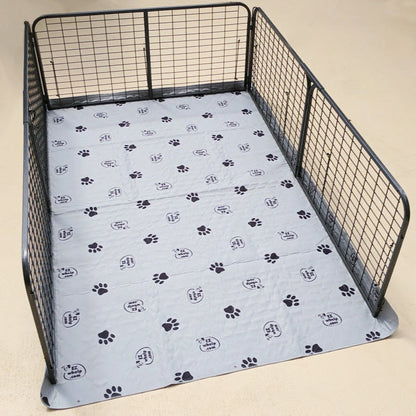 Pet playpen with a paw print mat on a beige background