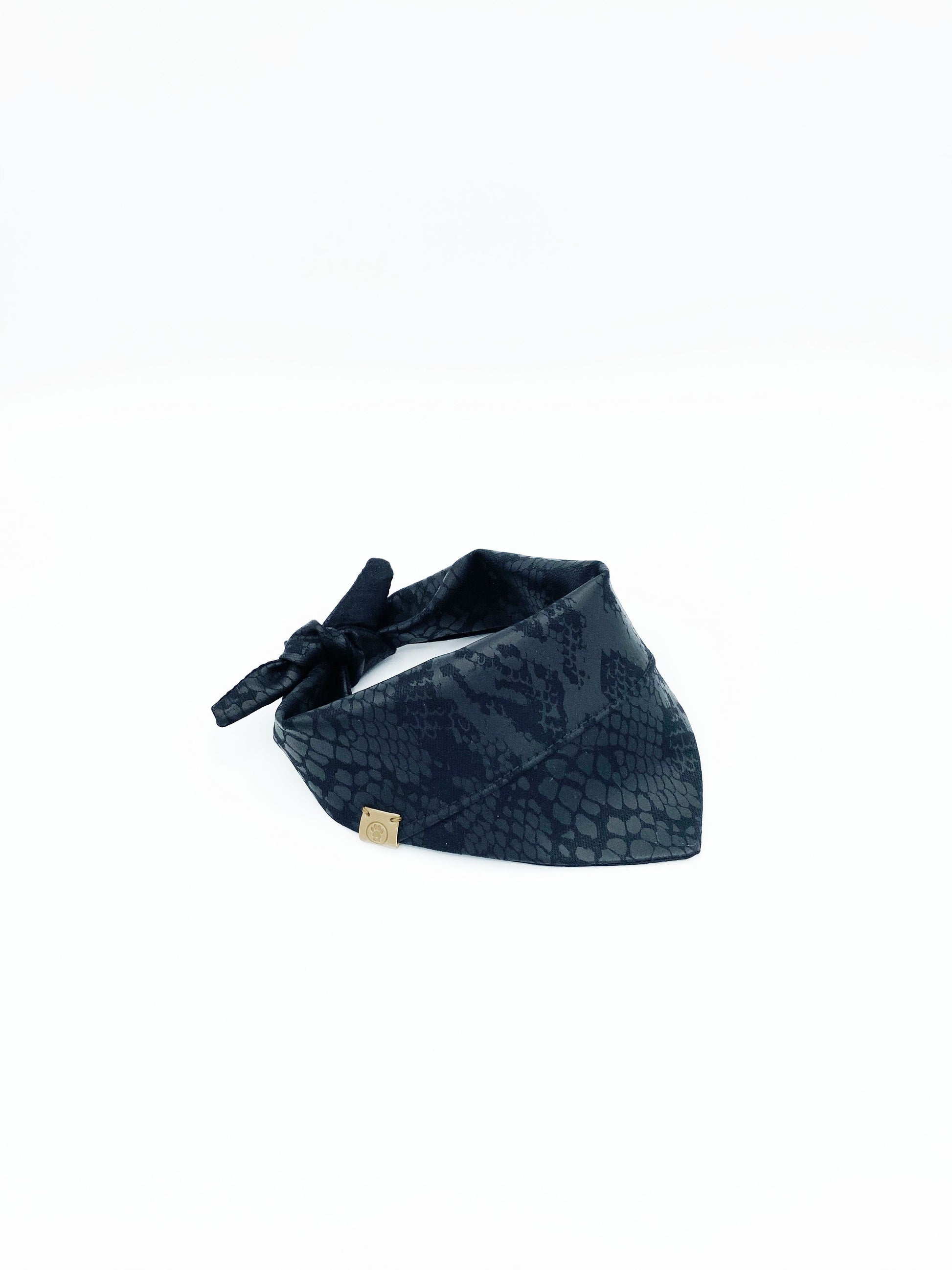 Navy blue patterned headband on a white background