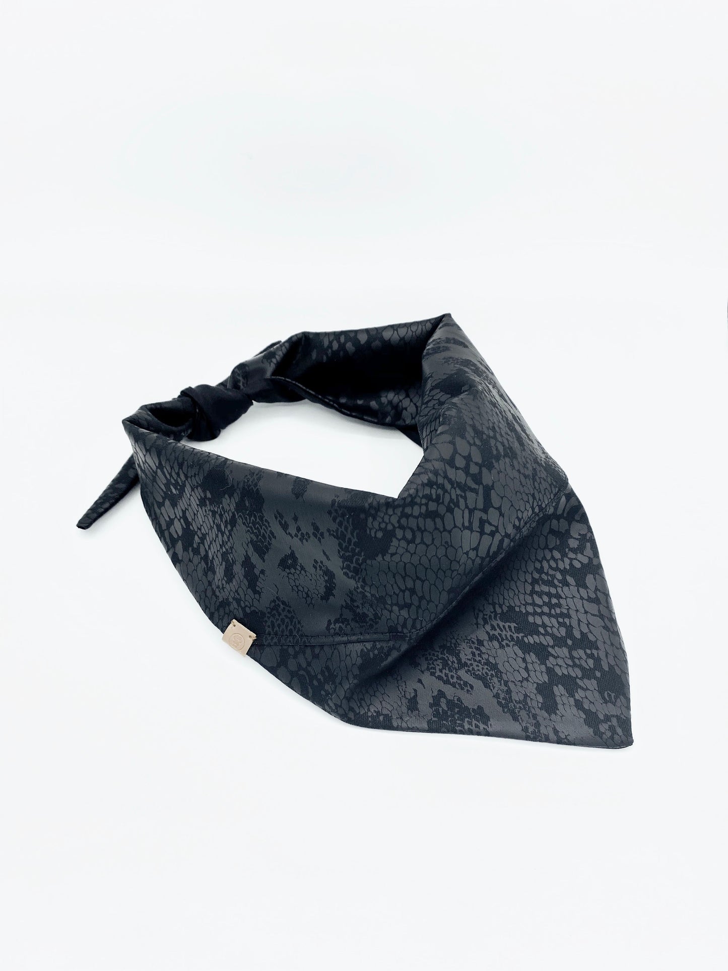 Black patterned bandana on a white background