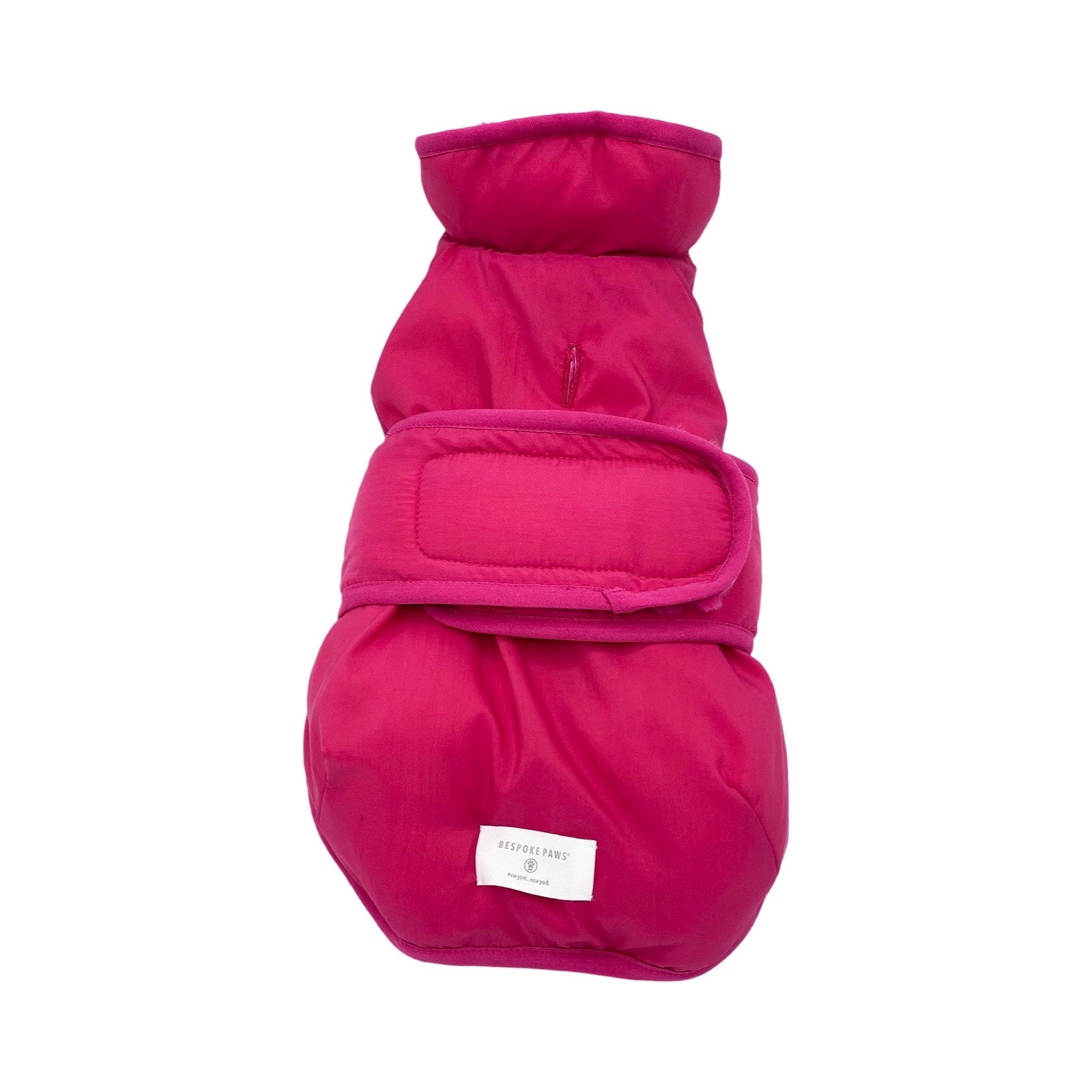 Pink dog coat with a brand label on a white background