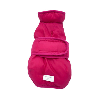Pink dog coat with a brand label on a white background