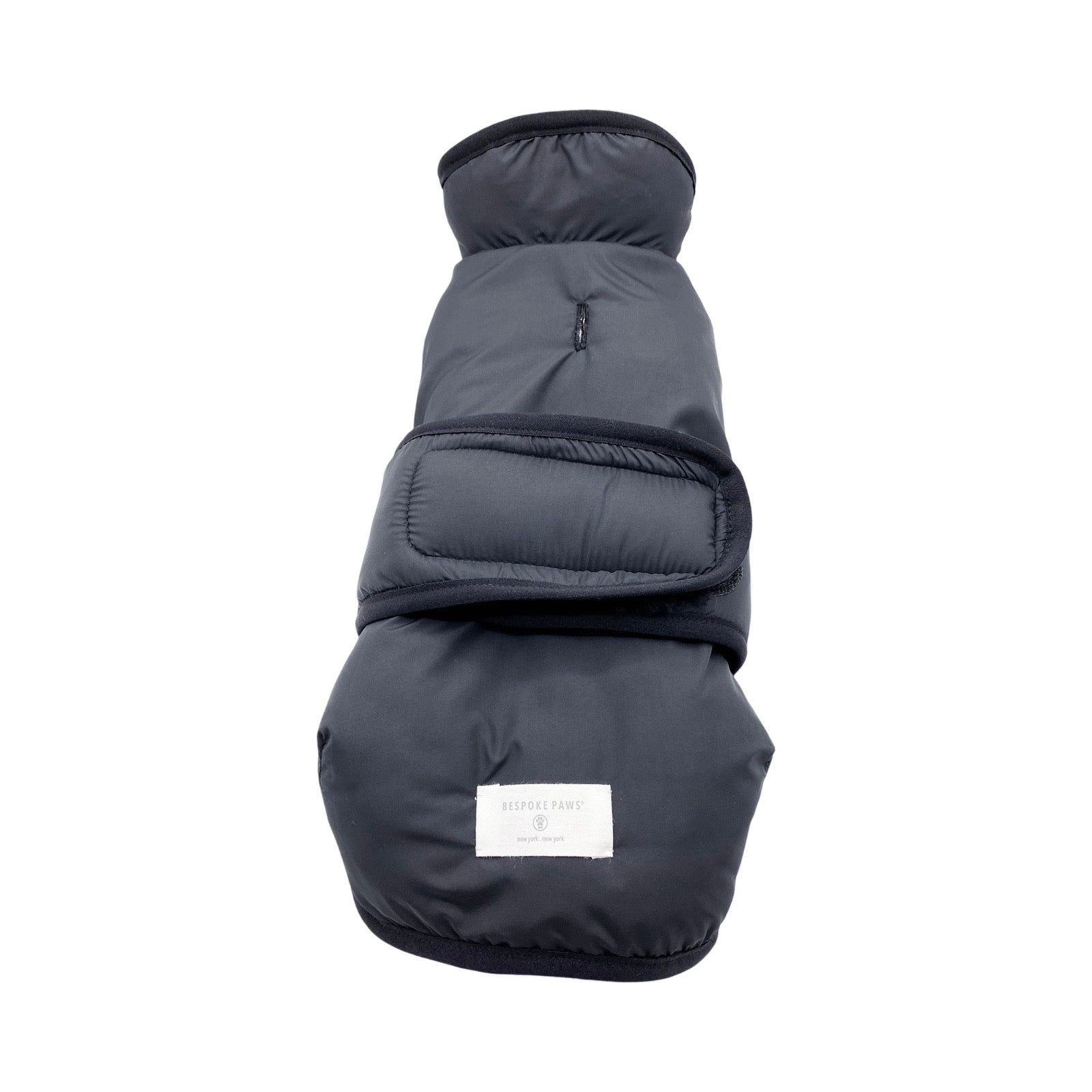 Dark gray dog coat with a brand label on a white background