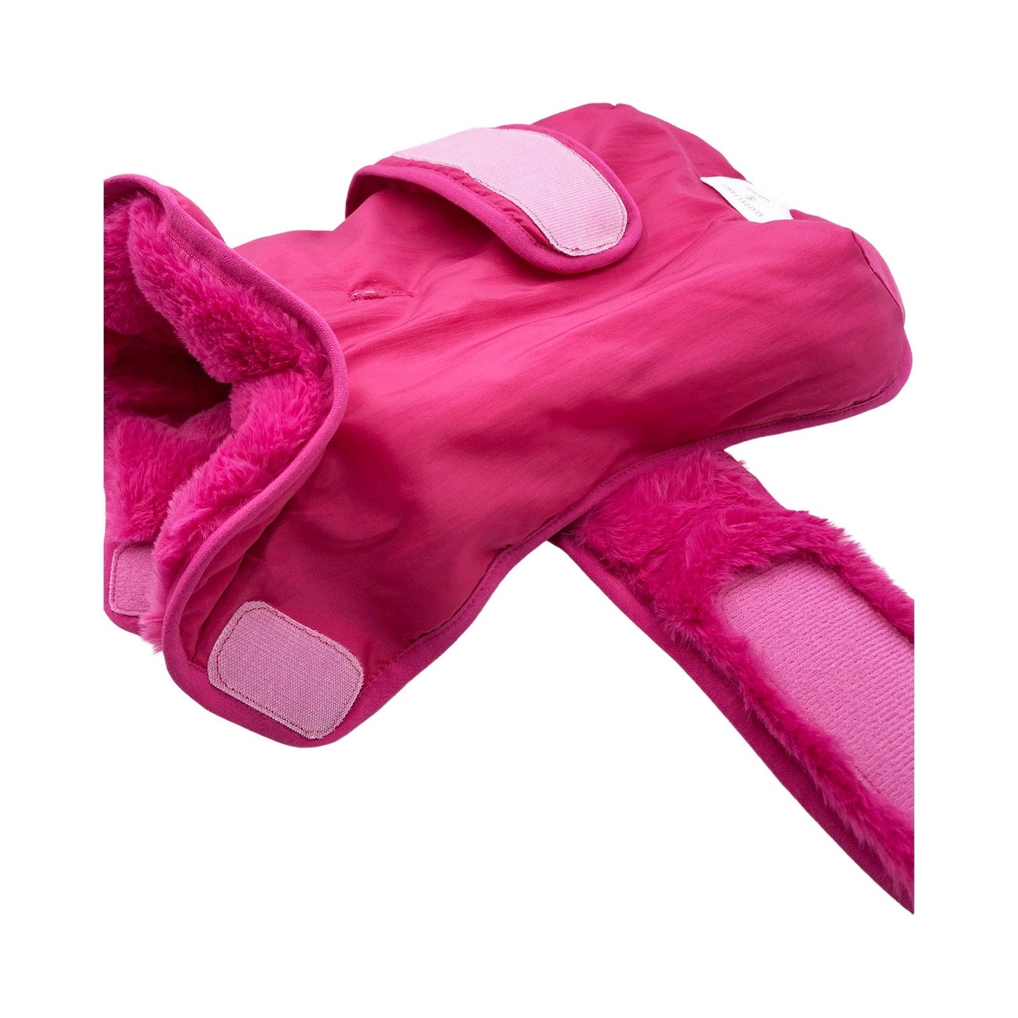 Pink slippers with fuzzy lining on a white background