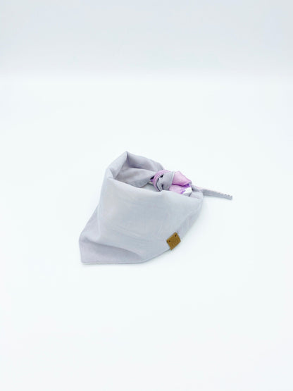 Baby bandana bib with purple accents on a white background