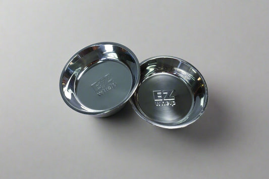 Two metallic bowls on a gray background