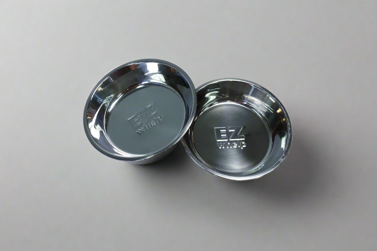 Two metallic bowls on a gray background