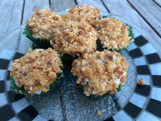 Cupcakes with a crumbly topping on a checkered plate